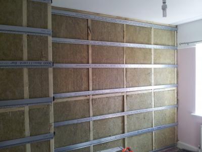 Stud partition built, insulation fitted & resilient bars installed.