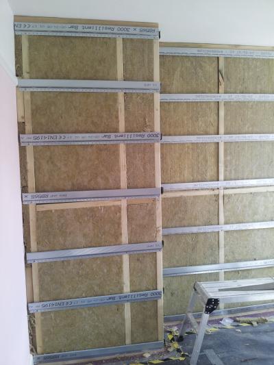 Stud partition built, insulation fitted & resilient bars installed.